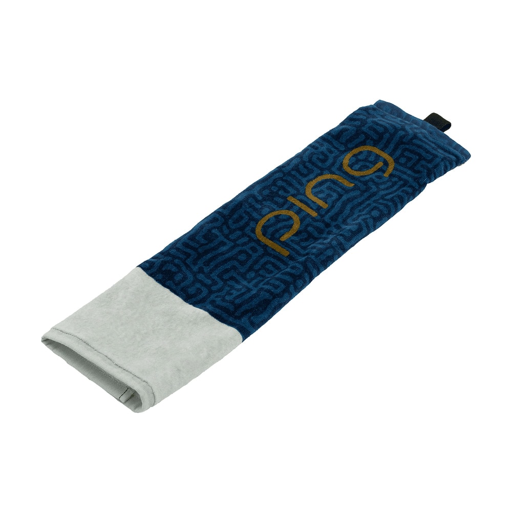 A folded Ping tri-fold golf towel, on white