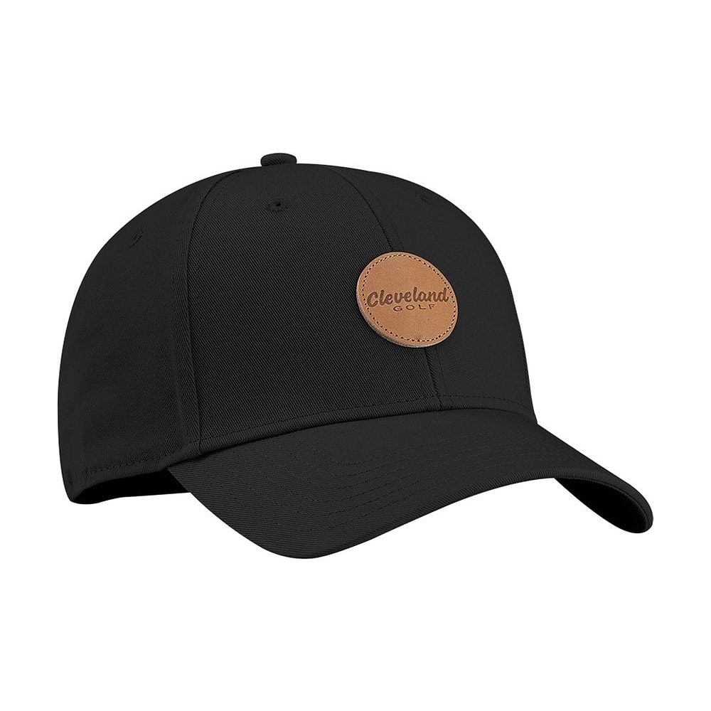 A black Cleveland Golf cap with a leather patch, on white