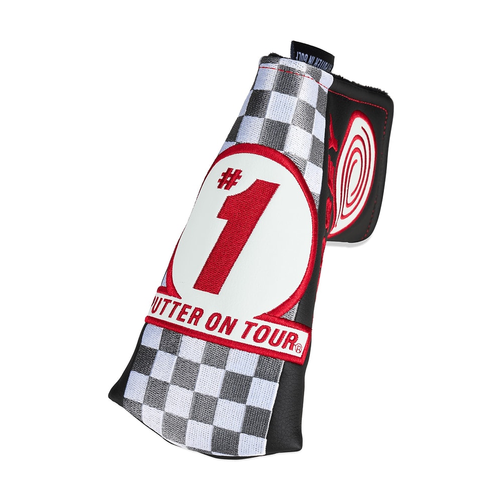 A chequered Odyssey Tempest blade putter headcover, on white