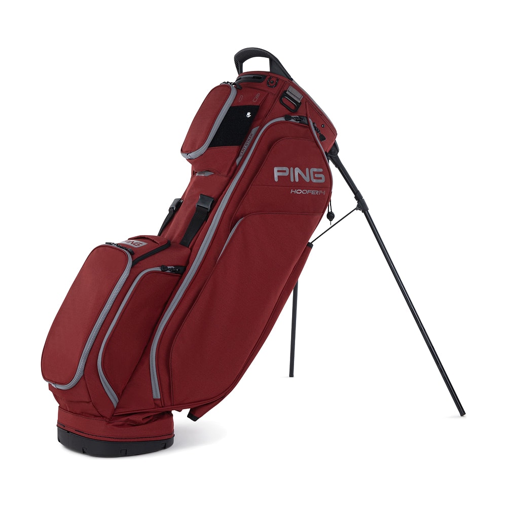 A Ping Hoofer 14 stand bag in deep red, legs out, on white